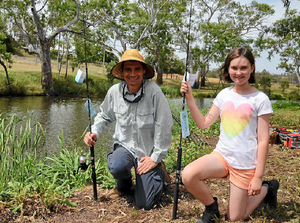 FAMILY FISHING: Michael Litchfield landed the heaviest carp and his daughter Madeleine won a lucky draw prize at the Warwick Condamine Alliance Carp Fishing Competition.